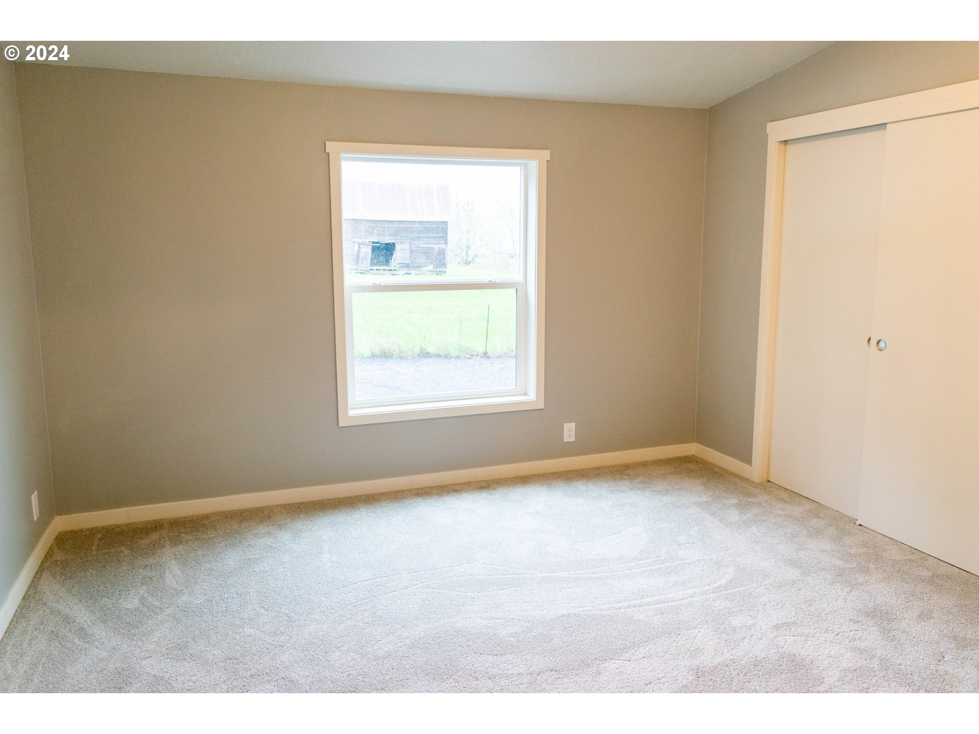 28157 Cottage Grove Lorane Road Cottage Grove, OR 97424 - Photo 12 of 33 an empty room with a window