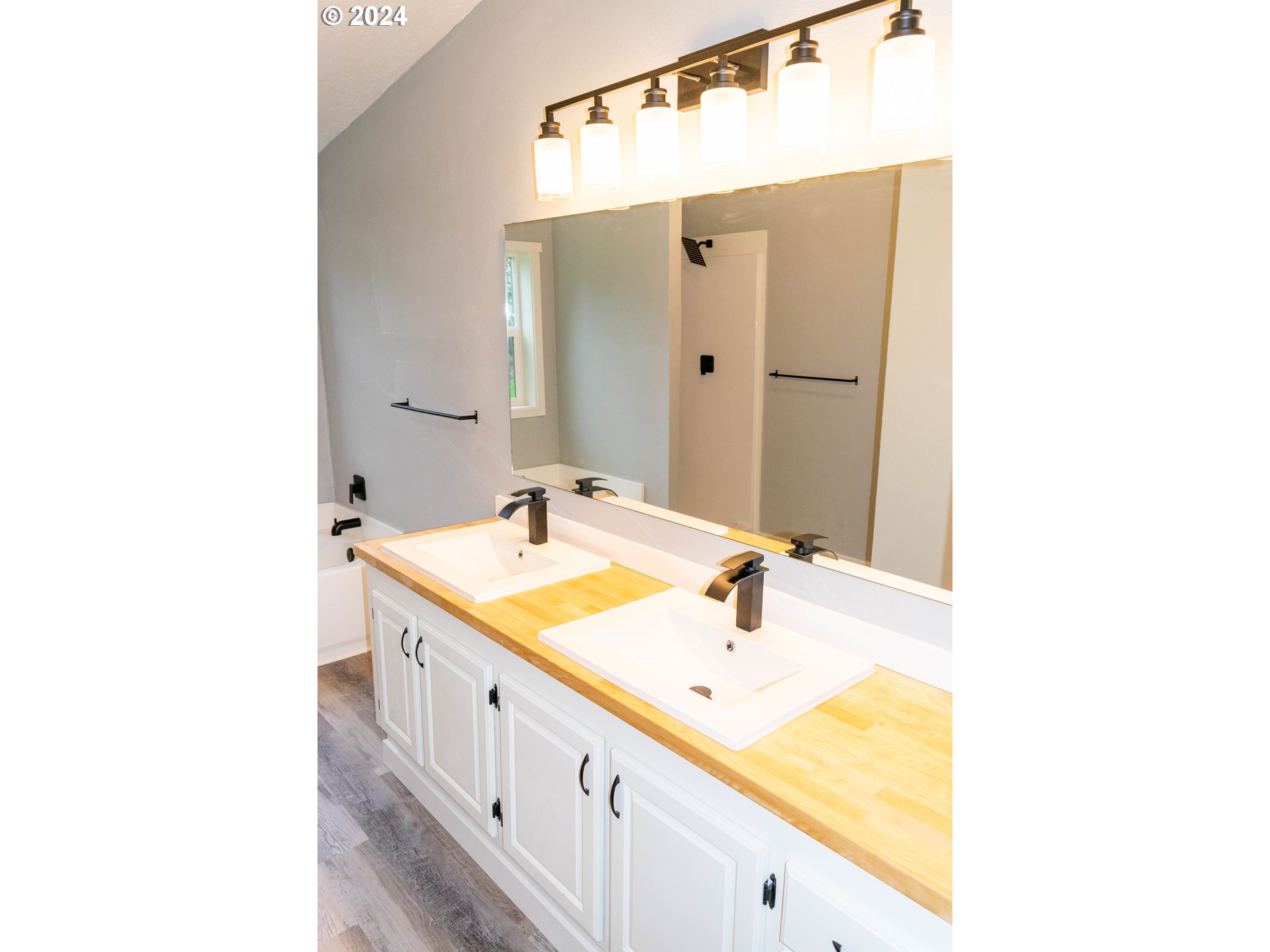 28157 Cottage Grove Lorane Road Cottage Grove, OR 97424 - Photo 14 of 33 a bathroom with a double vanity sink and mirror