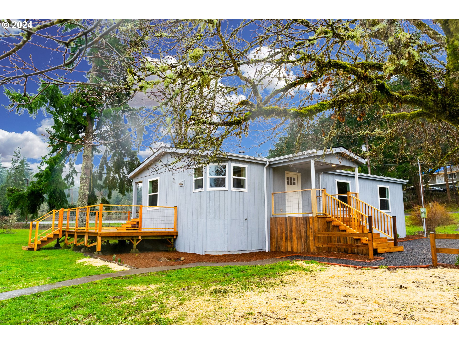 28157 Cottage Grove Lorane Road Cottage Grove, OR 97424 - Photo 2 of 33 a view of a house with a yard