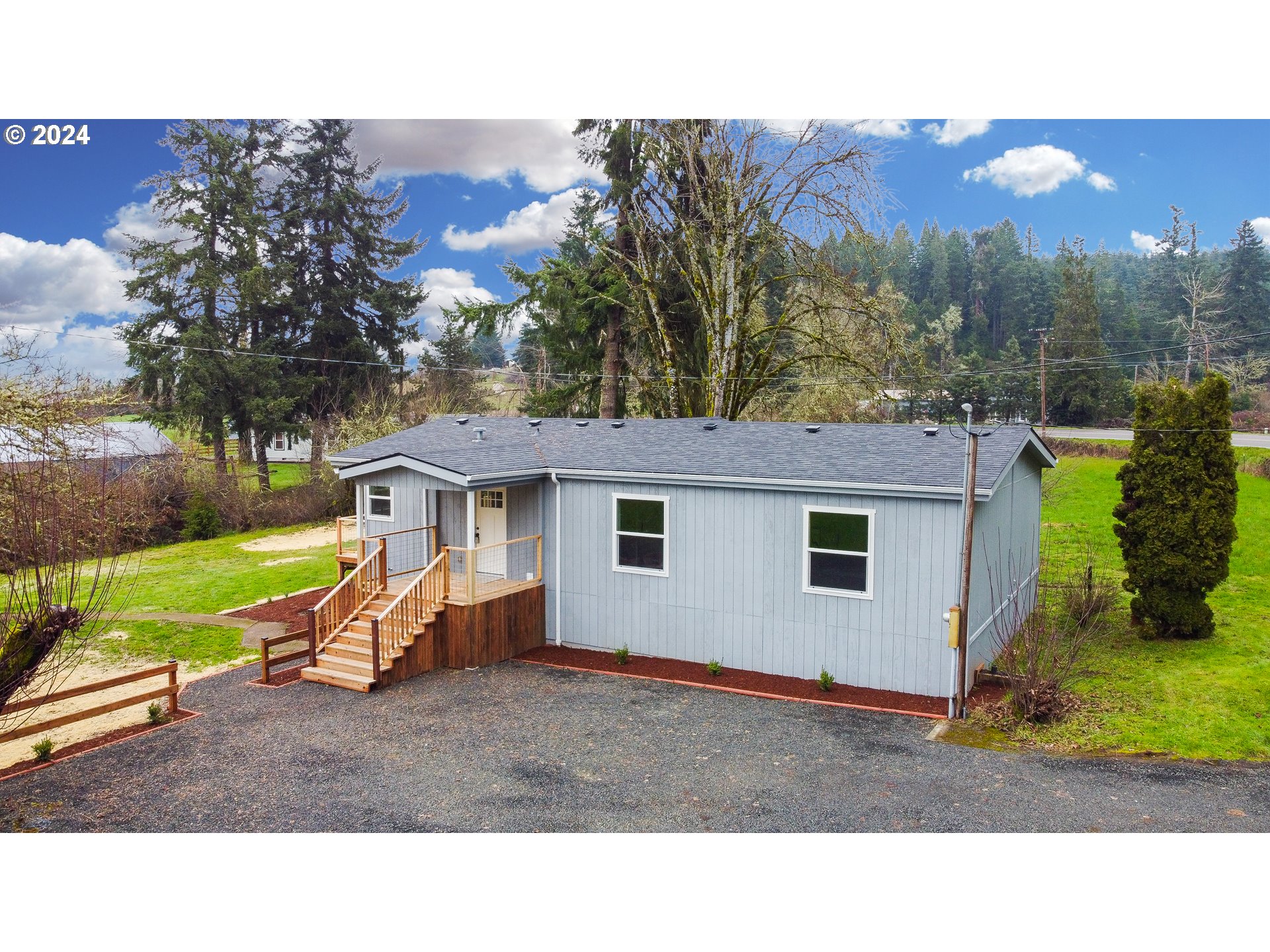 28157 Cottage Grove Lorane Road Cottage Grove, OR 97424 - Photo 26 of 33 a backyard of a house with a yard and outdoor seating