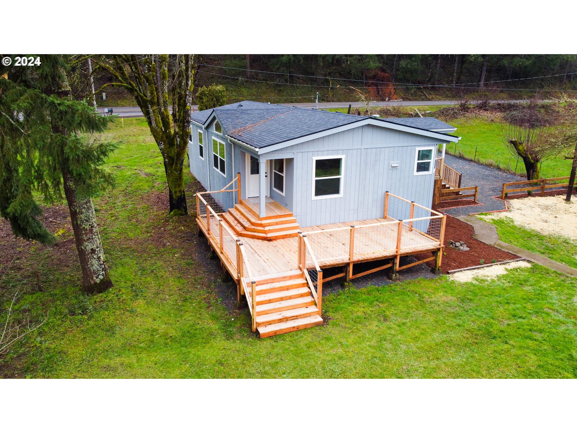 28157 Cottage Grove Lorane Road Cottage Grove, OR 97424 - Photo 31 of 33 a aerial view of a house with a garden