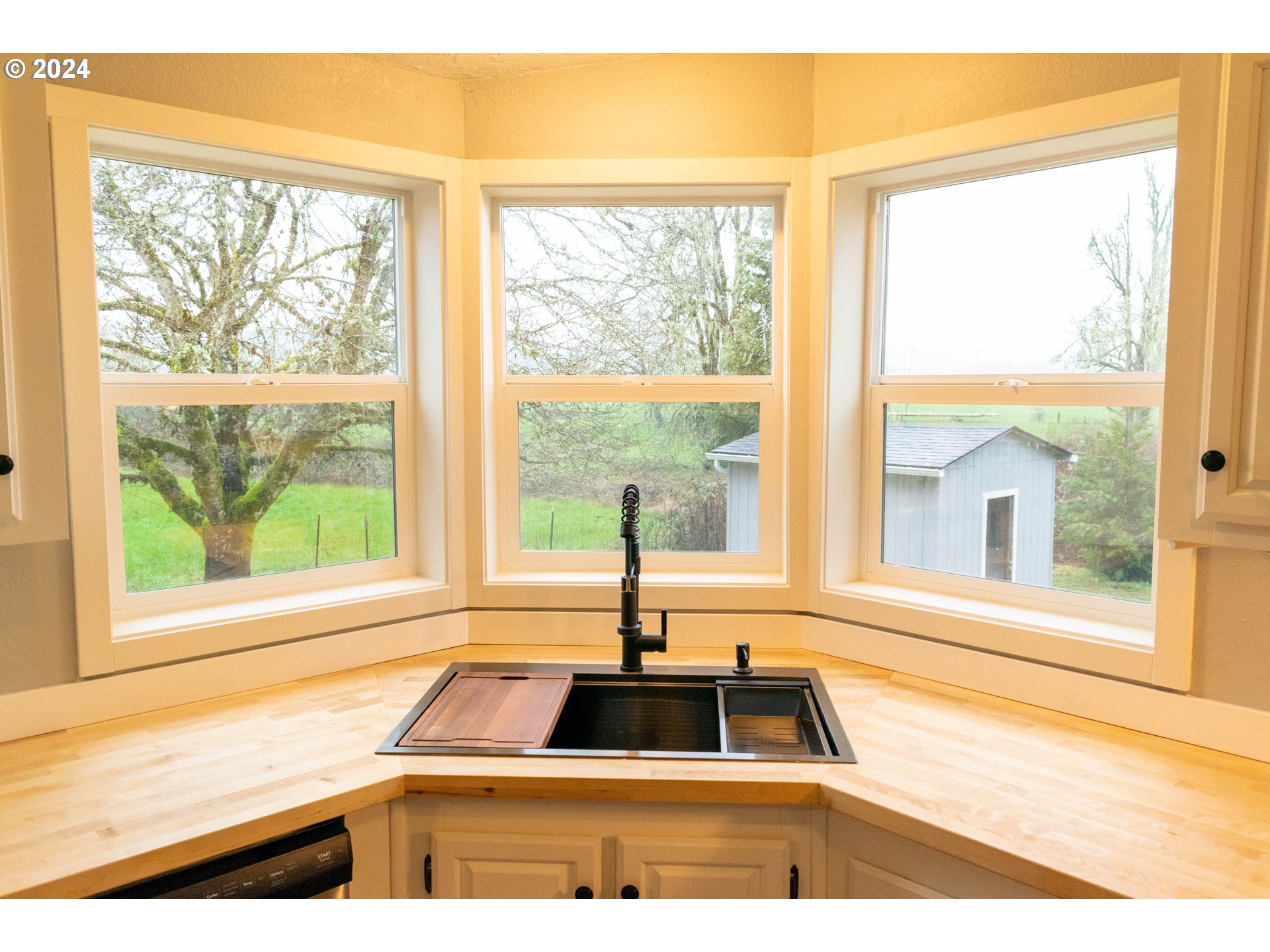 28157 Cottage Grove Lorane Road Cottage Grove, OR 97424 - Photo 8 of 33 a kitchen with a window and a sink