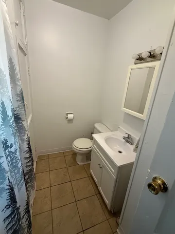 a bathroom with a sink toilet and vanity