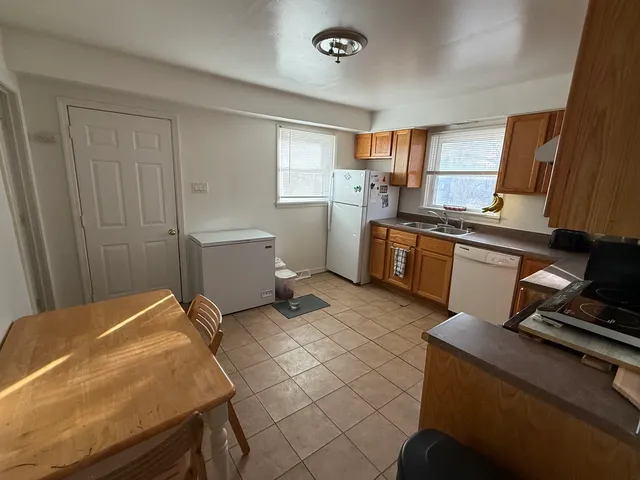 a kitchen with a sink appliances and cabinets