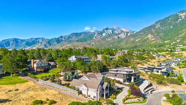 3 Carriagewood Cove, Unit 1088 Sandy, UT 84092 - Photo 77 of 79 Mountain landscape with multiple residences showcasing varied architectural styles