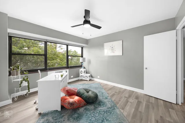 a room with furniture and a large window