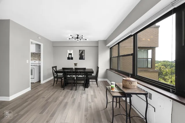 a dining room with furniture and wooden floor