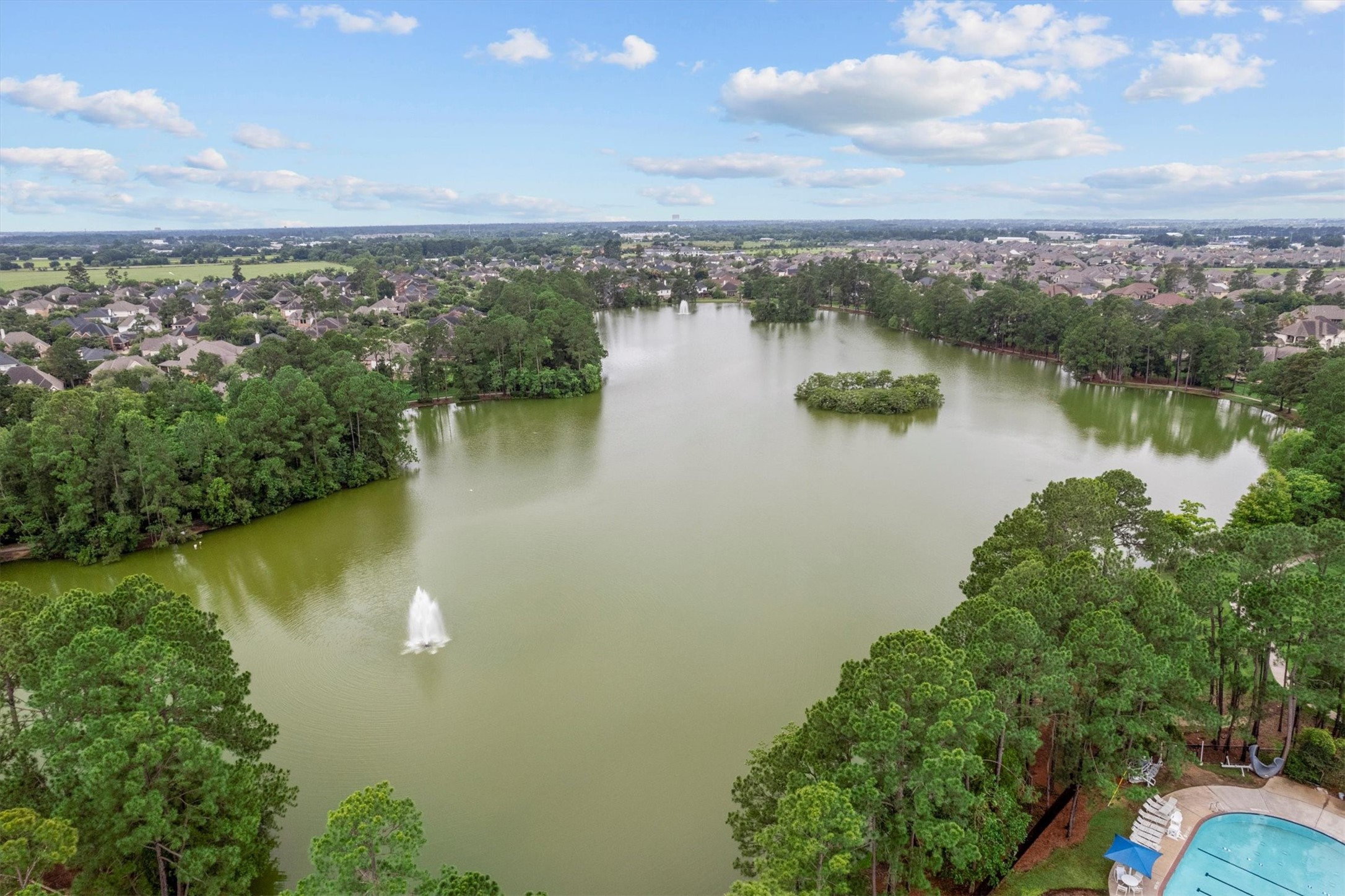 6323 Stone Trail Lane Spring, TX 77379 - Photo 35 of 43 a view of a lake with a city