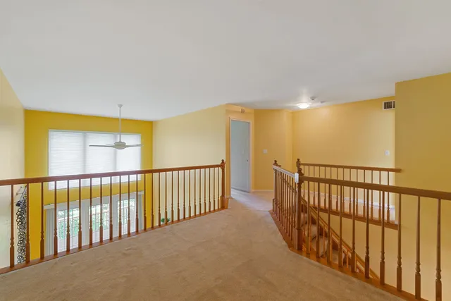 a view of a hallway with a large window