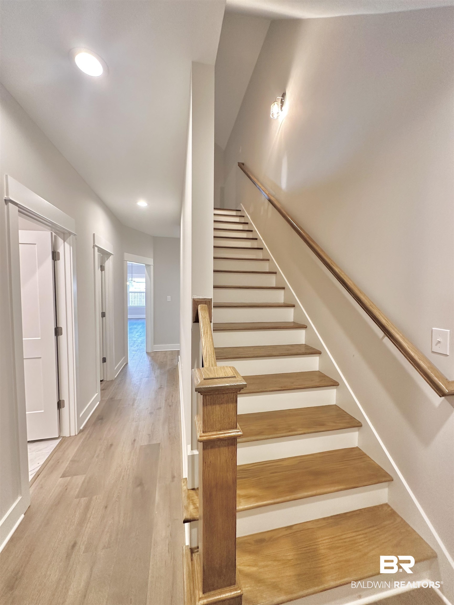 634 Kitfox Avenue Fairhope, AL 36532 - Photo 23 of 33 Staircase featuring hardwood / wood-style floors