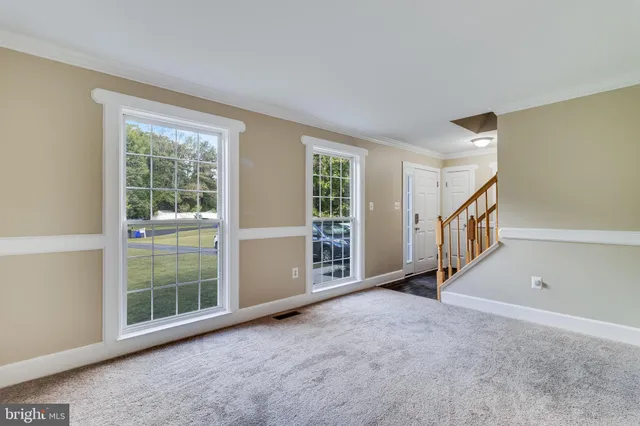 a view of an empty room with glass door
