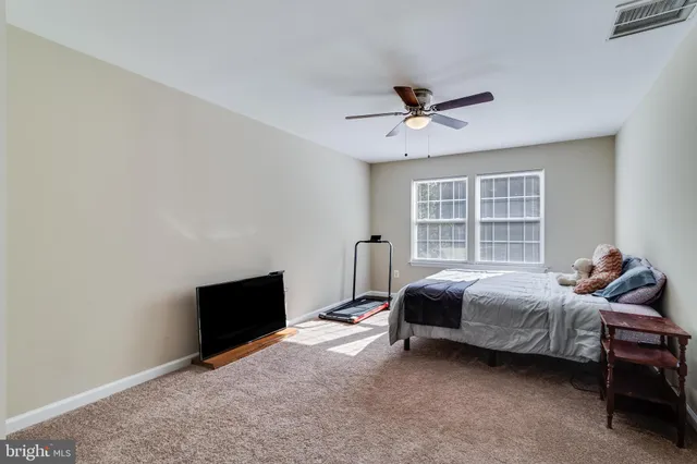 a bedroom with bed and window