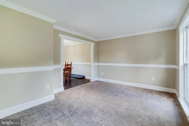 a view of a room with furniture and a window