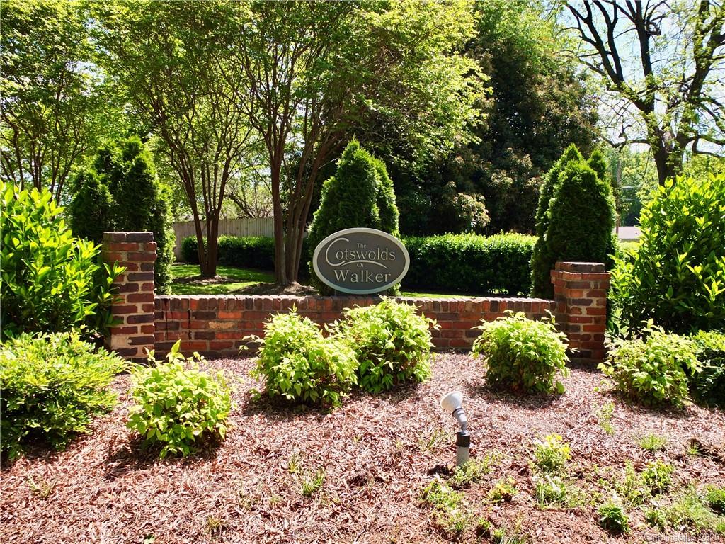 4317 Walker Road, Unit B Charlotte, NC 28211 - Photo 2 of 25 a backyard of a house with a garden and outdoor seating