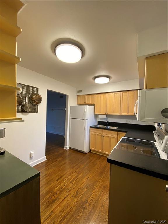 4317 Walker Road, Unit B Charlotte, NC 28211 - Photo 11 of 25 a kitchen with stainless steel appliances granite countertop a refrigerator and a stove
