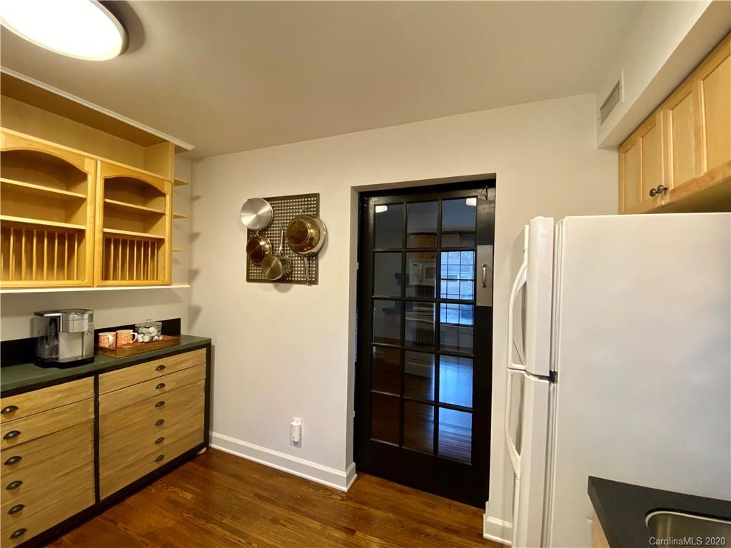 4317 Walker Road, Unit B Charlotte, NC 28211 - Photo 13 of 25 a view of a kitchen with refrigerator and cabinet