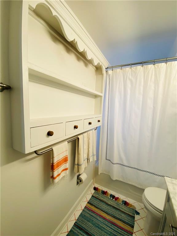 4317 Walker Road, Unit B Charlotte, NC 28211 - Photo 18 of 25 a bathroom with a sink and a mirror