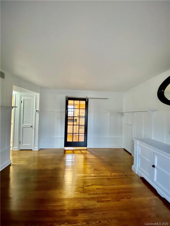 4317 Walker Road, Unit B Charlotte, NC 28211 - Photo 7 of 25 a view of an empty room with window and wooden floor