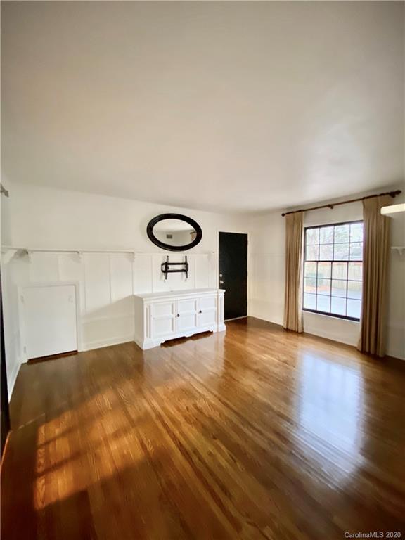 4317 Walker Road, Unit B Charlotte, NC 28211 - Photo 8 of 25 a view of a livingroom with wooden floor and a window