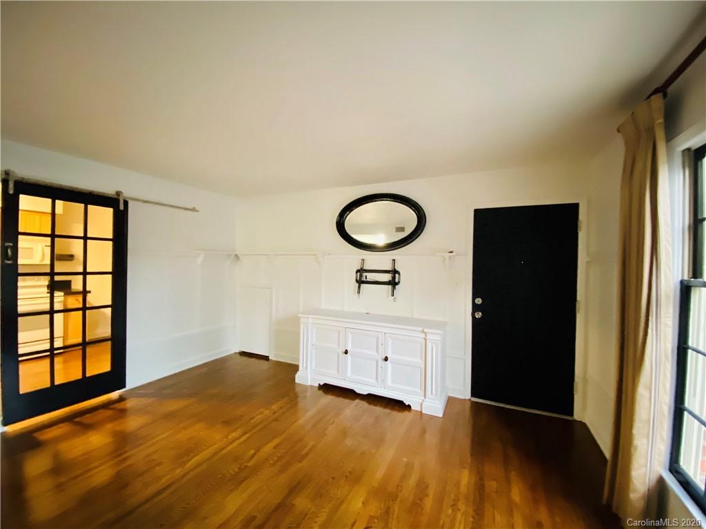 4317 Walker Road, Unit B Charlotte, NC 28211 - Photo 9 of 25 a bedroom with a bed and a window