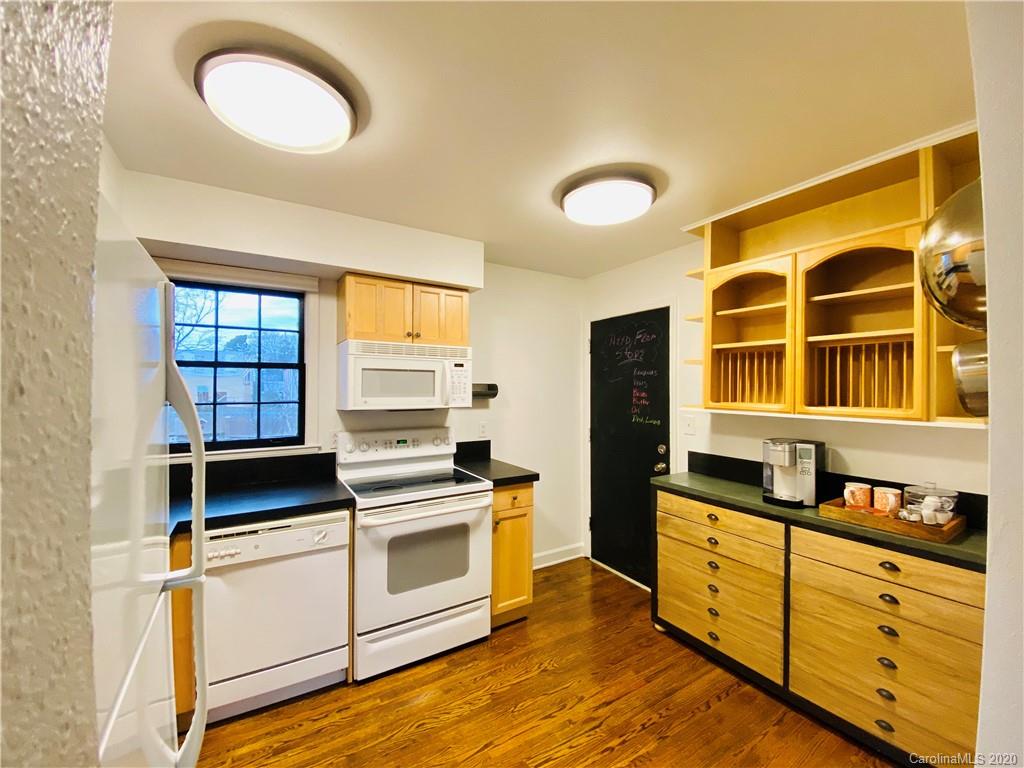 4317 Walker Road, Unit B Charlotte, NC 28211 - Photo 10 of 25 a kitchen with a stove a sink and a window