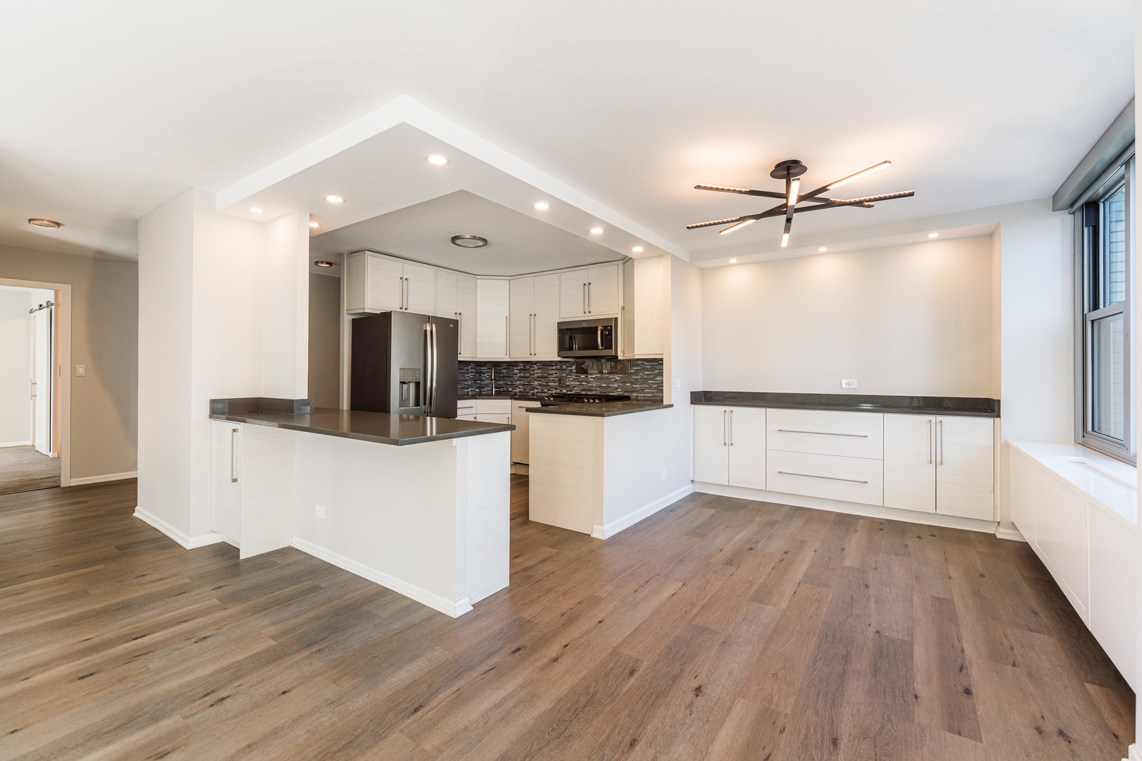 400 East Randolph Street, Unit 3629 Chicago, IL 60601 - Photo 4 of 36 a view of kitchen with microwave and wooden floor
