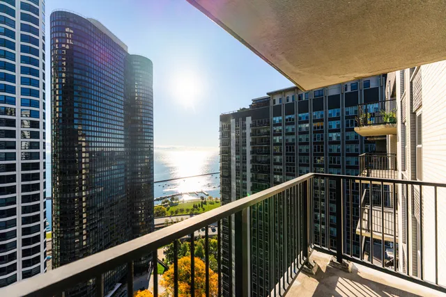 a view of balcony with a red umbrella