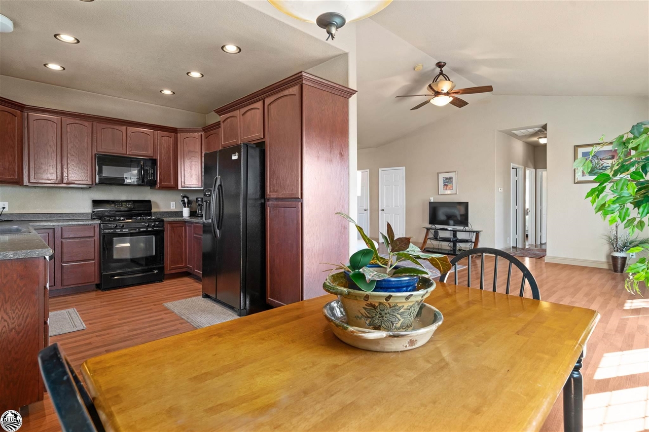 3102 Quail Hill Road Copperopolis, CA 95228 - Photo 12 of 60 a kitchen with sink a refrigerator and microwave