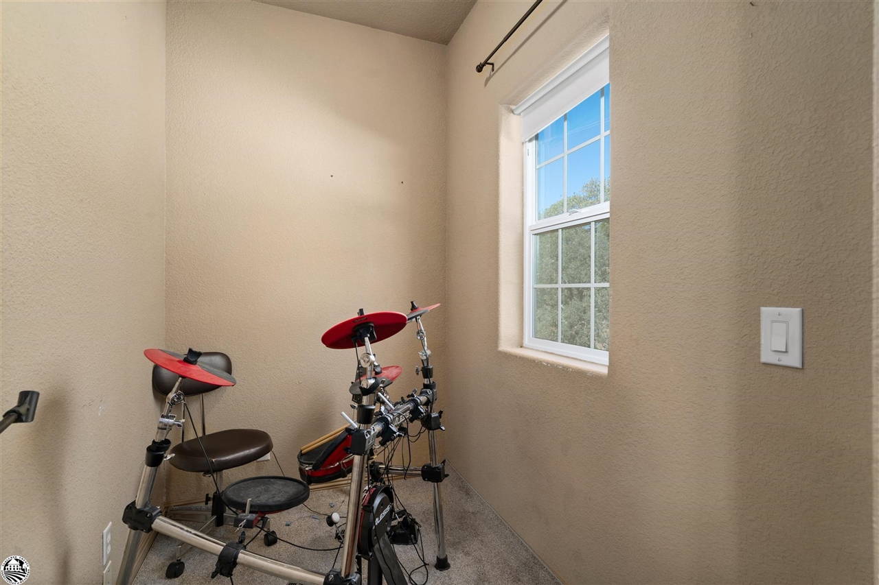 3102 Quail Hill Road Copperopolis, CA 95228 - Photo 22 of 60 a view of a workspace with furniture and a window