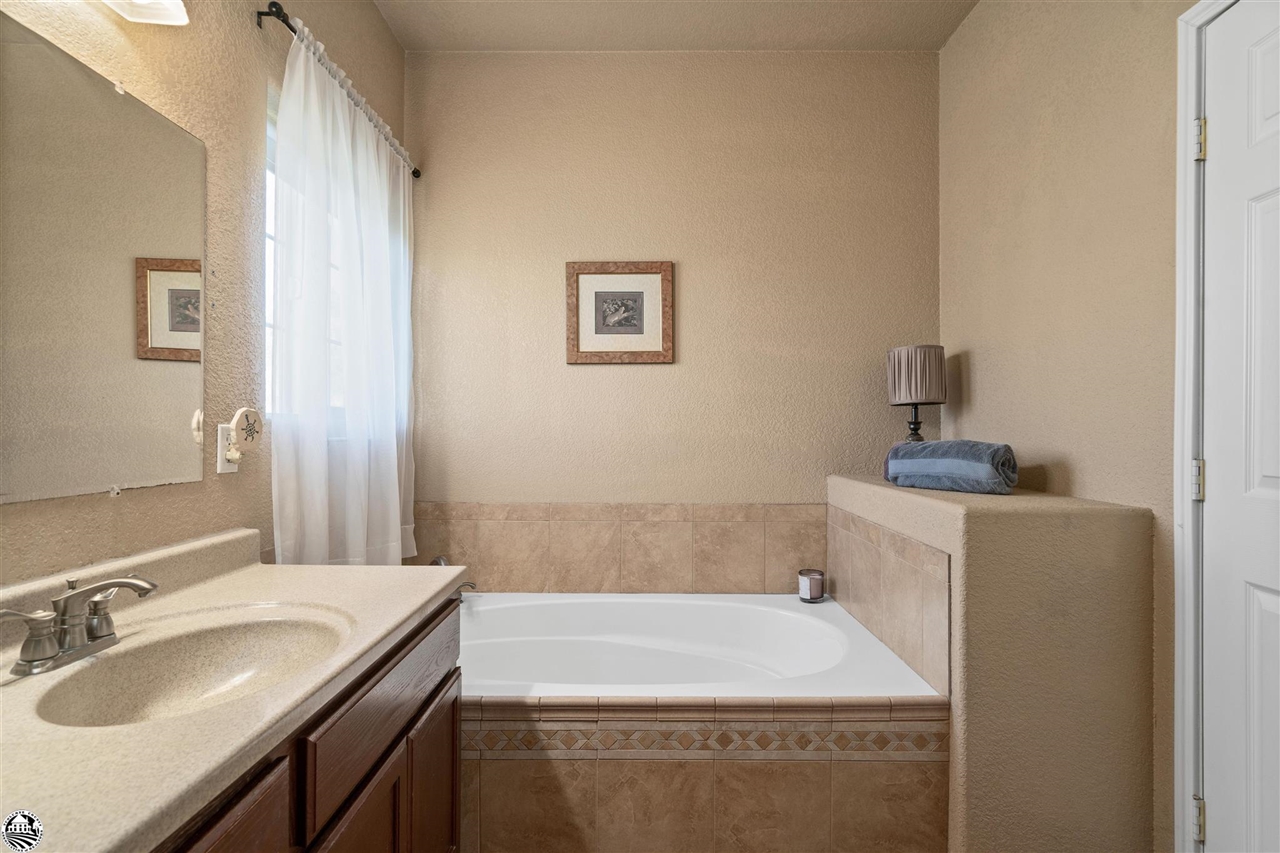 3102 Quail Hill Road Copperopolis, CA 95228 - Photo 24 of 60 a bathroom with a sink and a mirror