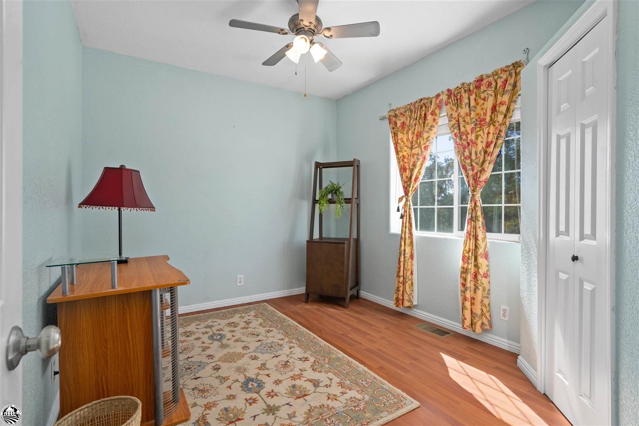 3102 Quail Hill Road Copperopolis, CA 95228 - Photo 29 of 60 wooden floor chandelier and windows in a room