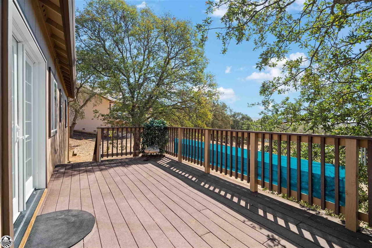 3102 Quail Hill Road Copperopolis, CA 95228 - Photo 39 of 60 a view of balcony with wooden floor and fence