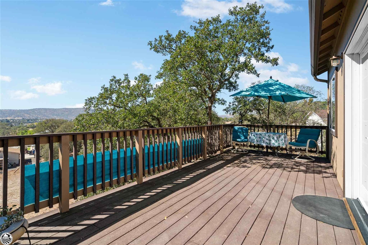 3102 Quail Hill Road Copperopolis, CA 95228 - Photo 40 of 60 a view of balcony with wooden floor and fence