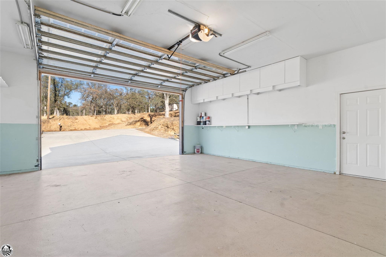 3102 Quail Hill Road Copperopolis, CA 95228 - Photo 53 of 60 a view of a room with wooden floor and a ceiling fan