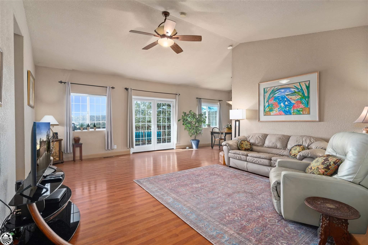 3102 Quail Hill Road Copperopolis, CA 95228 - Photo 6 of 60 a living room with furniture windows and a flat screen tv