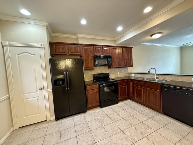 1000 Spring Loop, Unit 1806 College Station, TX 77840 - Photo 7 of 33 a kitchen with stainless steel appliances granite countertop a refrigerator and a sink