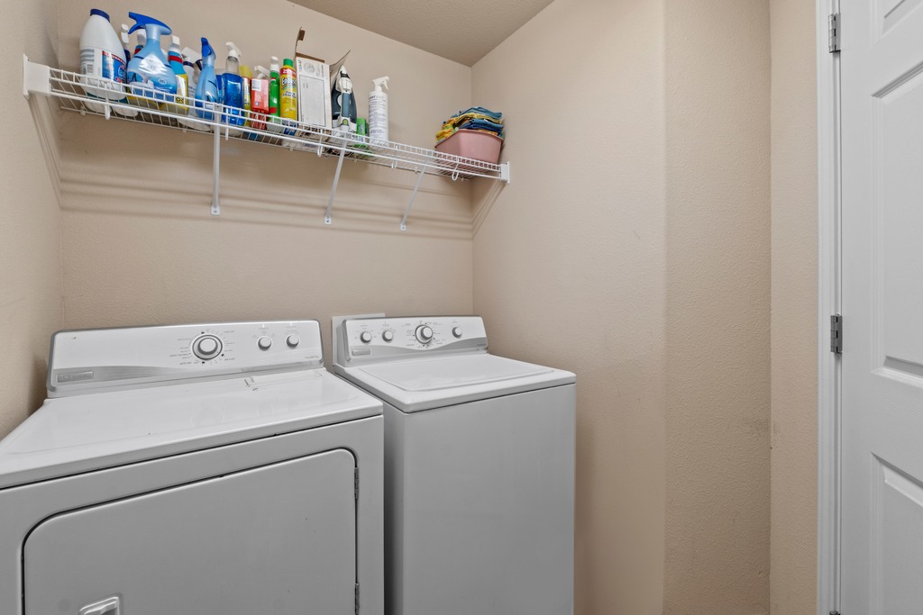 12008 Lansdowne Road Austin, TX 78754 - Photo 24 of 29 A well-organized laundry area offers a washer and dryer for household tasks.