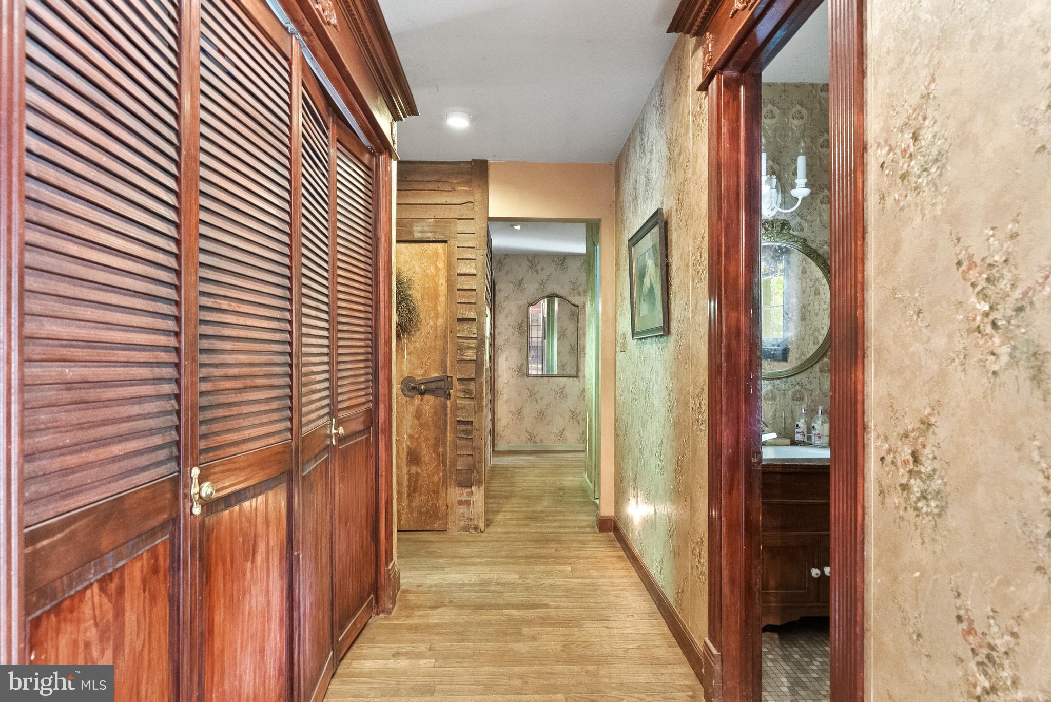 305 Hopewell Road Medford, NJ 08055 - Photo 15 of 30 a view of a hallway with wooden shelves