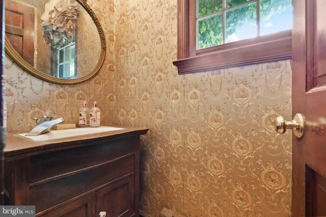 a very nice looking bedroom with a large window