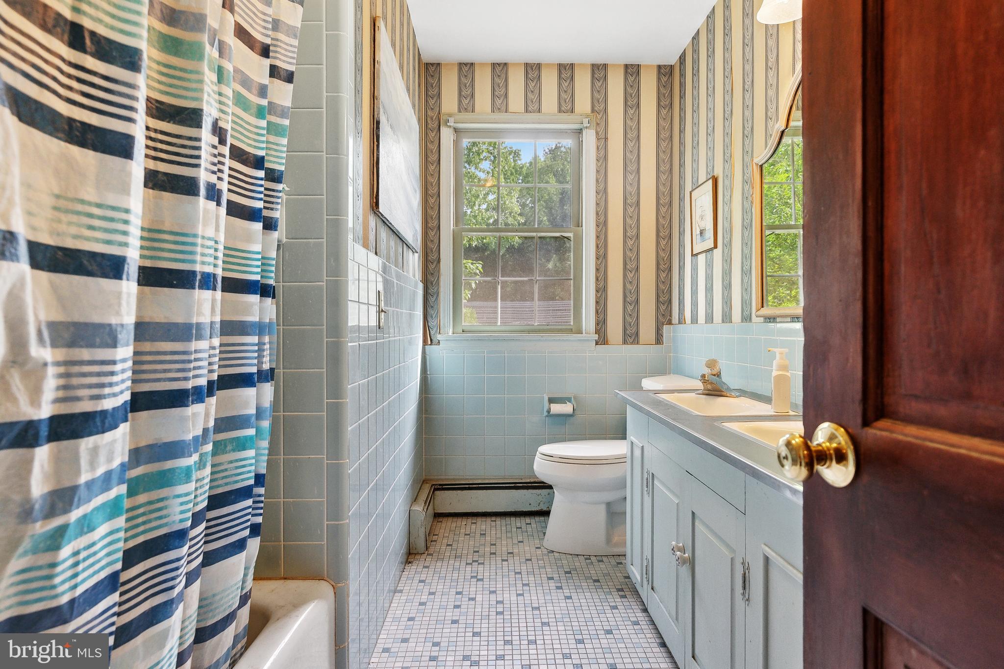 305 Hopewell Road Medford, NJ 08055 - Photo 19 of 30 a bathroom with a granite countertop toilet a sink and a shower