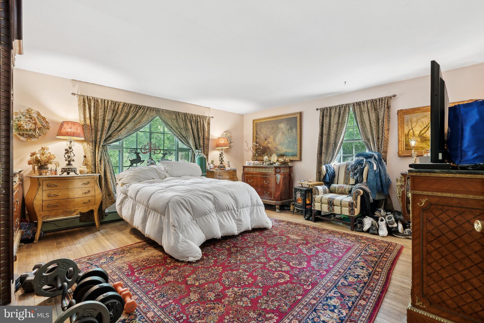 305 Hopewell Road Medford, NJ 08055 - Photo 20 of 30 a bedroom with a bed a couch and large window