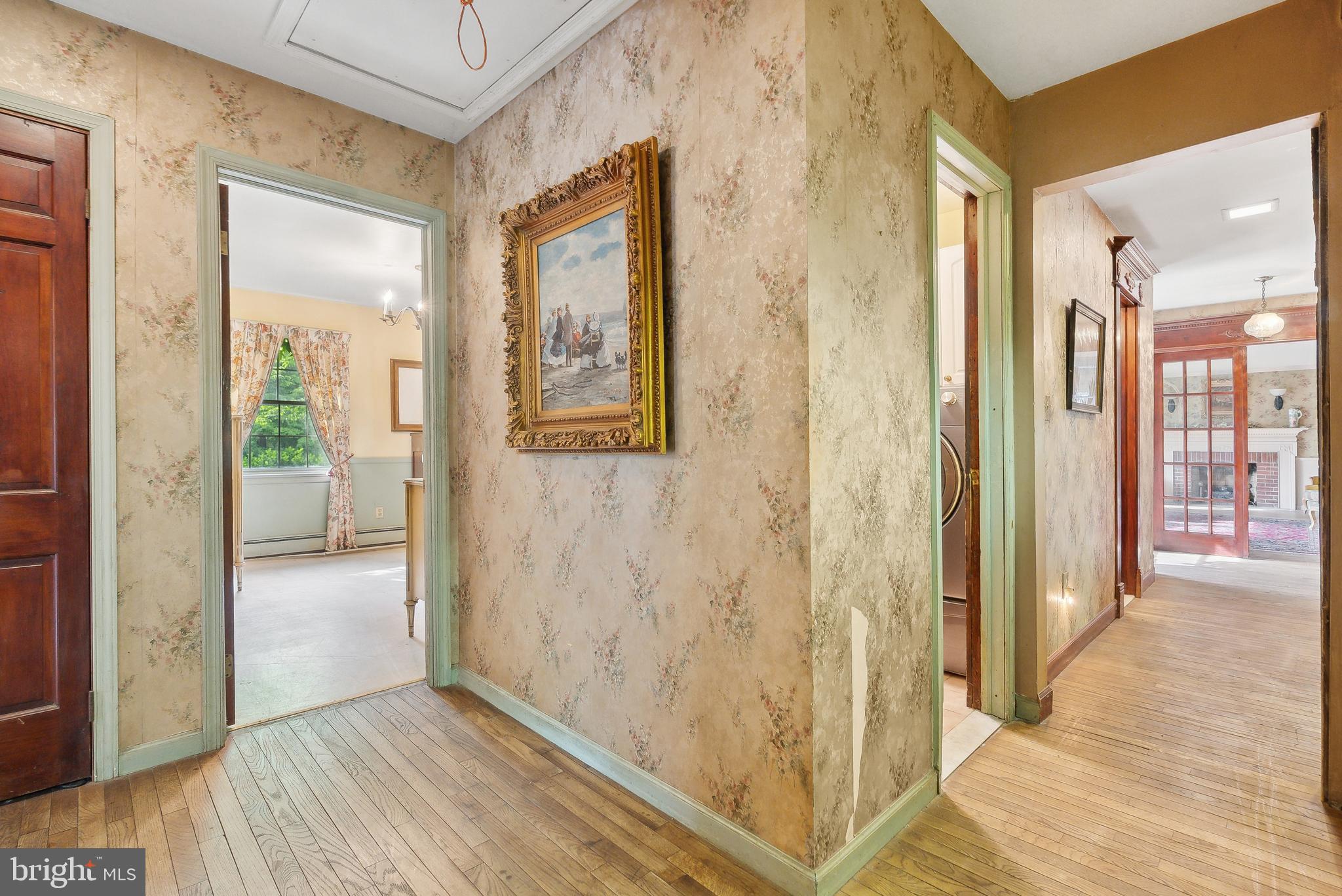 305 Hopewell Road Medford, NJ 08055 - Photo 21 of 30 a view of a hallway with wooden floor and a living room