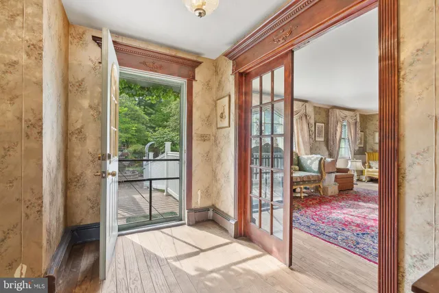 a very nice looking room with a large window and a bed