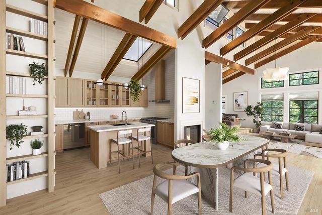 a view of a dining room with furniture large windows and wooden floor