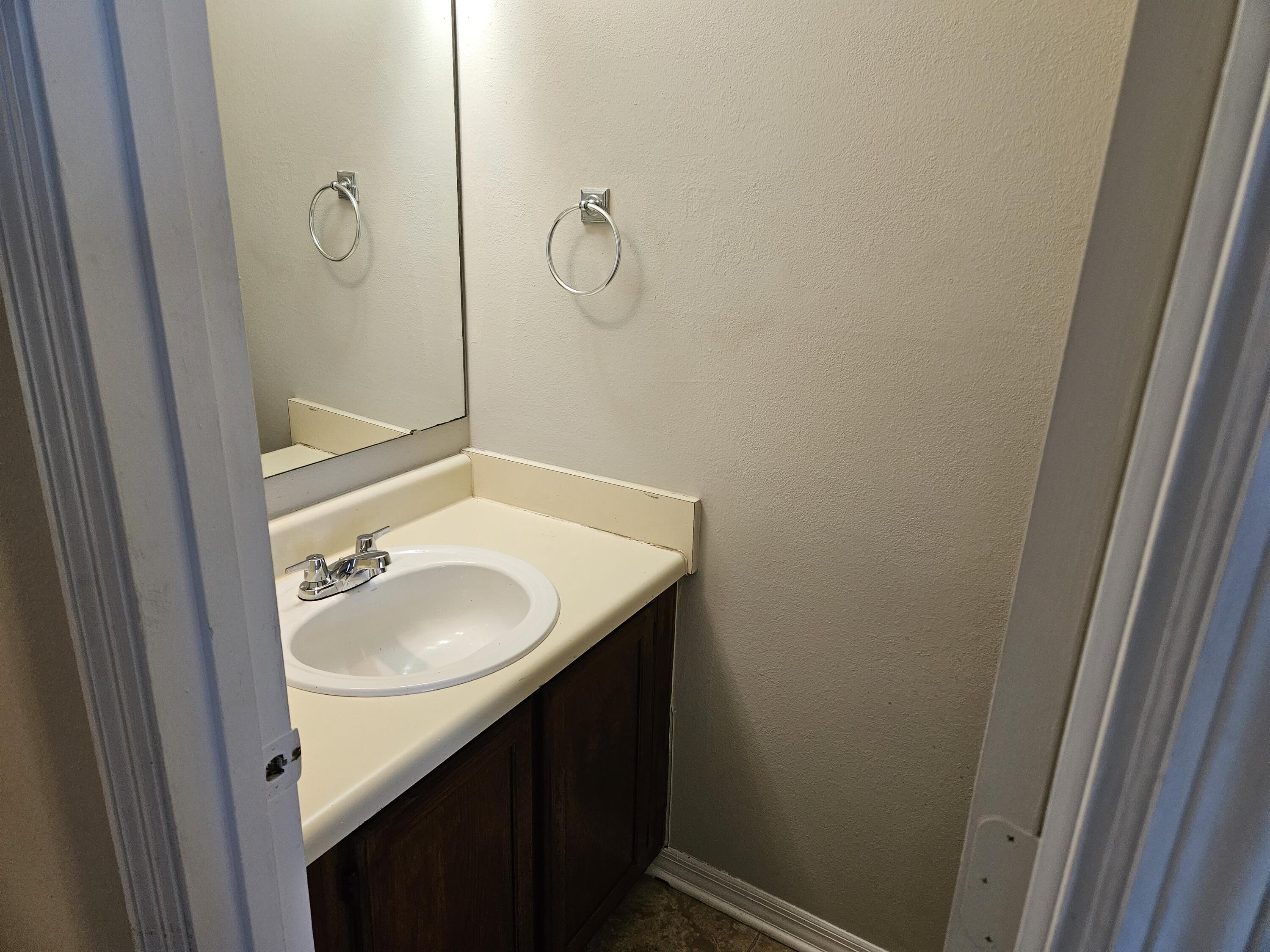 708 Bayshore Drive Niceville, FL 32578 - Photo 13 of 14 a bathroom with a sink and a mirror