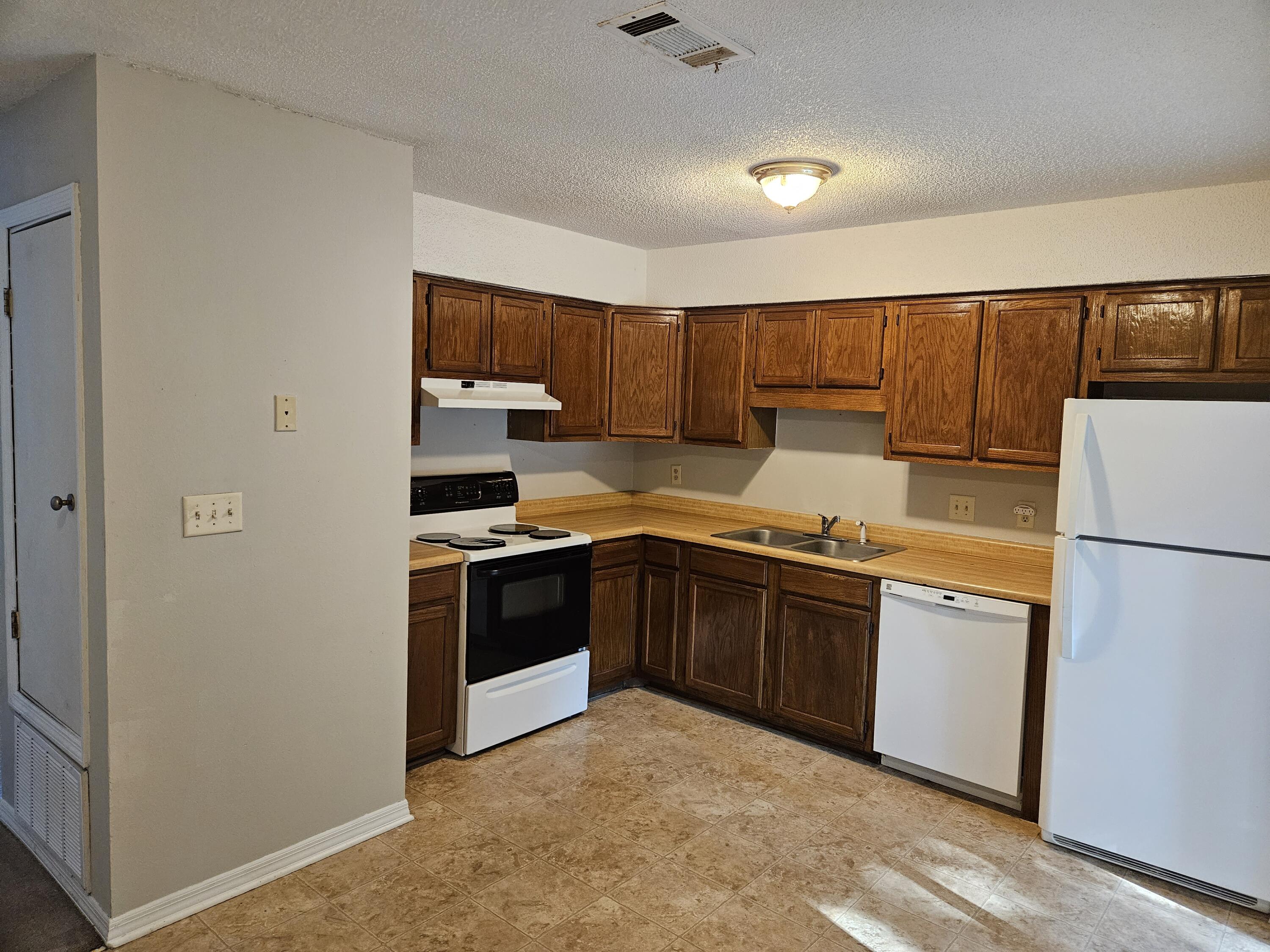 708 Bayshore Drive Niceville, FL 32578 - Photo 7 of 14 a kitchen with a refrigerator sink and stove