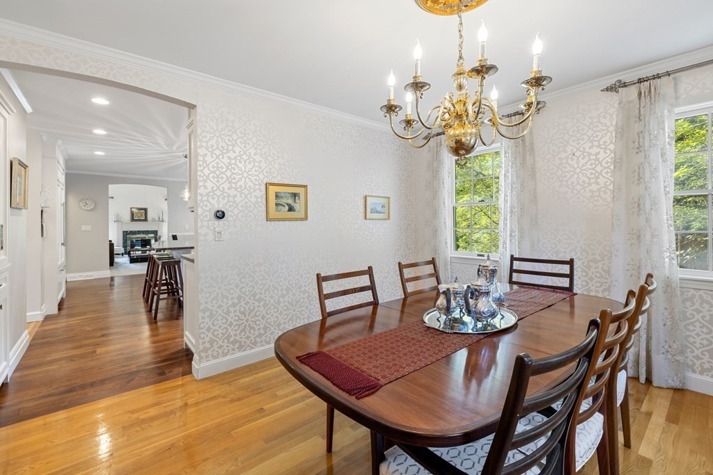 1 Douglas Road Lexington, MA 02420 - Photo 9 of 34 a view of a dining room with furniture a chandelier and wooden floor