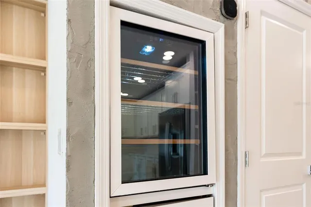 a kitchen with a sink and a mirror