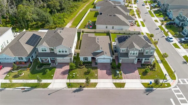 an aerial view of a city with ocean view