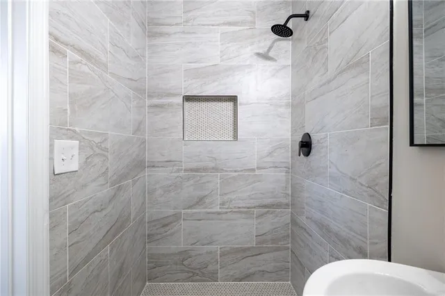 a bathroom with a toilet and shower